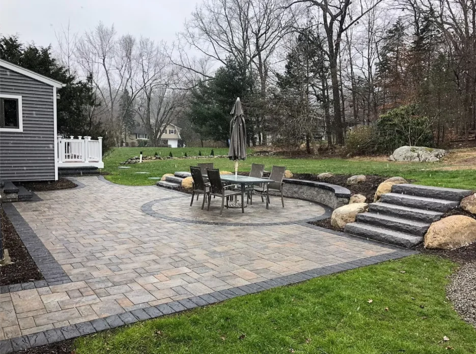 Herringbone brick walkway leading to garden gate