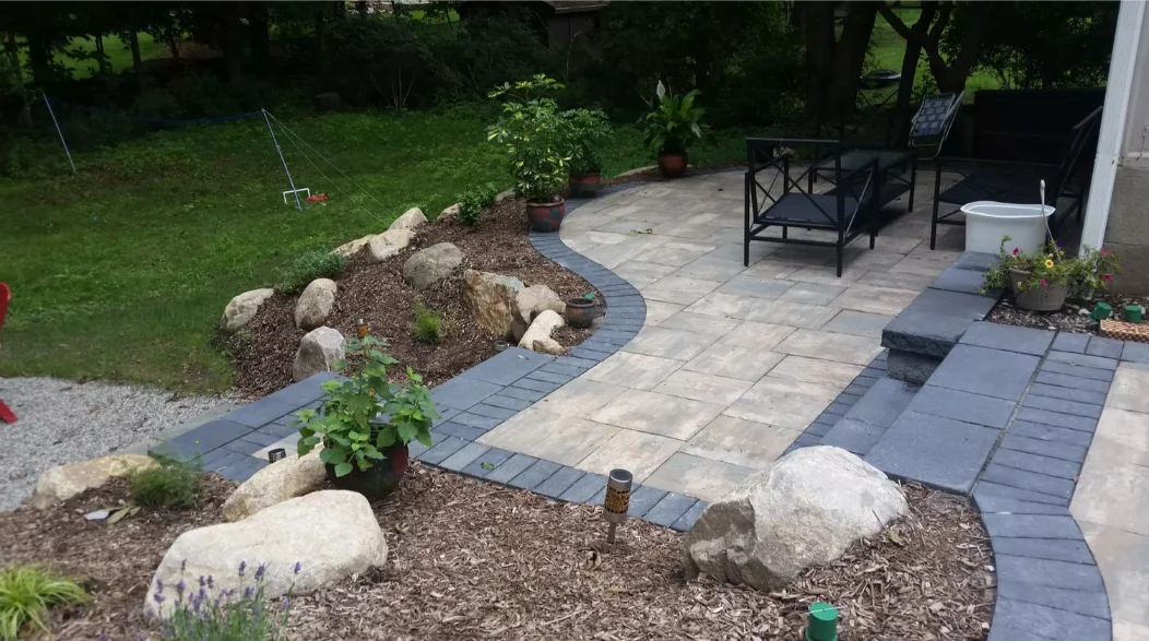 Stacked stone retaining wall with built‑in seating