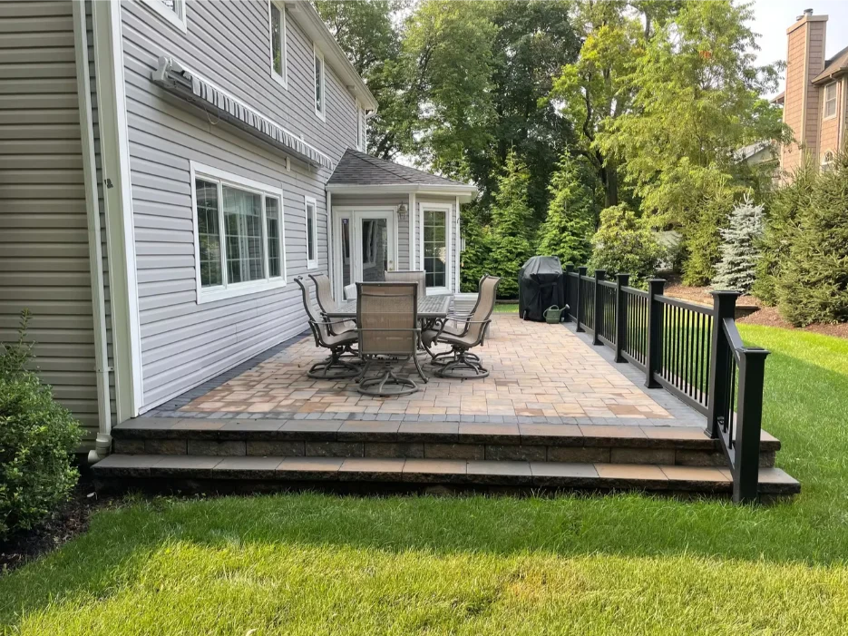 Corten steel raised planter with stone base